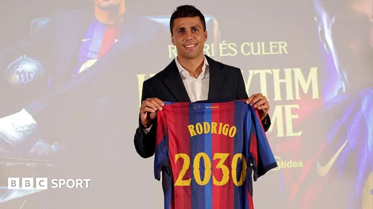 Player holding FC Barcelona jersey at presentation event
