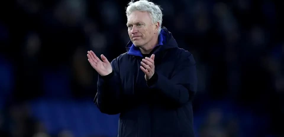 Manager applauding to the crowd after the match