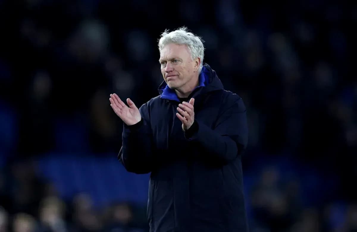 Manager applauding to the crowd after the match