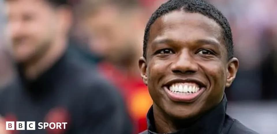 Smiling player in warm-up attire before match