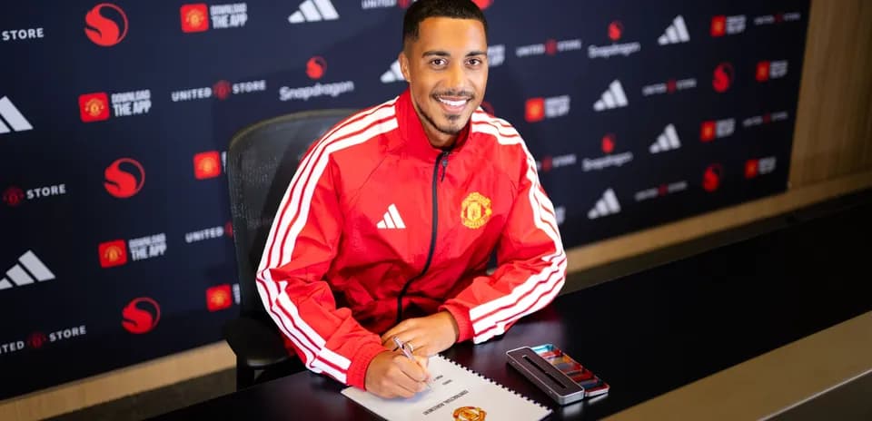 Player signing contract at Manchester United announcement event