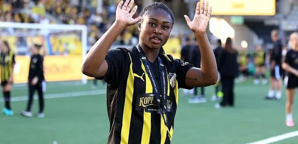Player waving with hands after match celebration