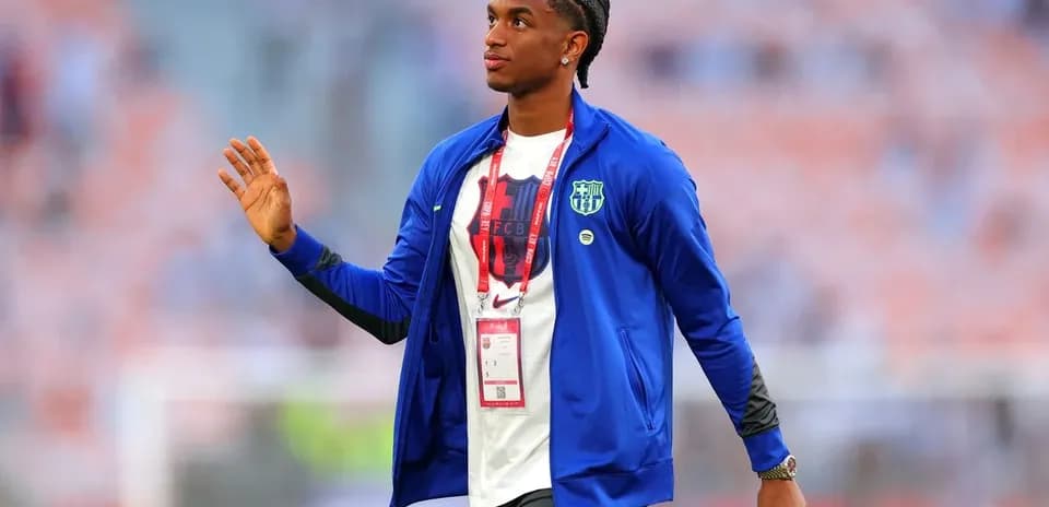 Player in FC Barcelona jacket greeting fans