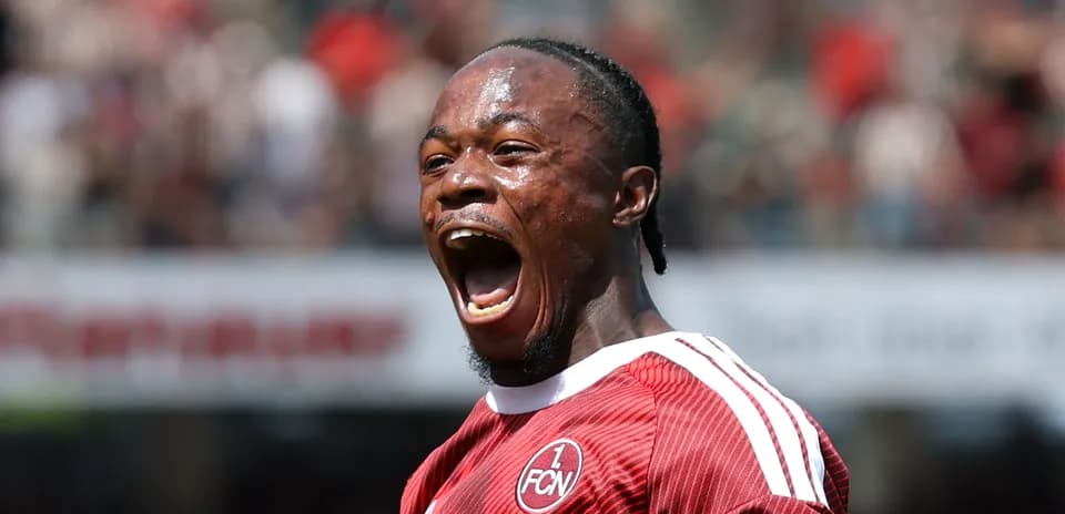 Player celebrating a goal in red team jersey