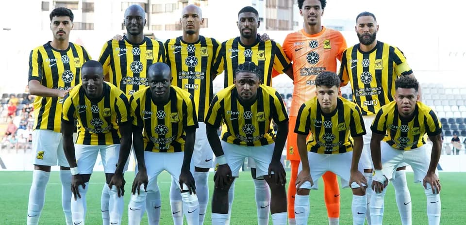 Football team posing in yellow and black jerseys