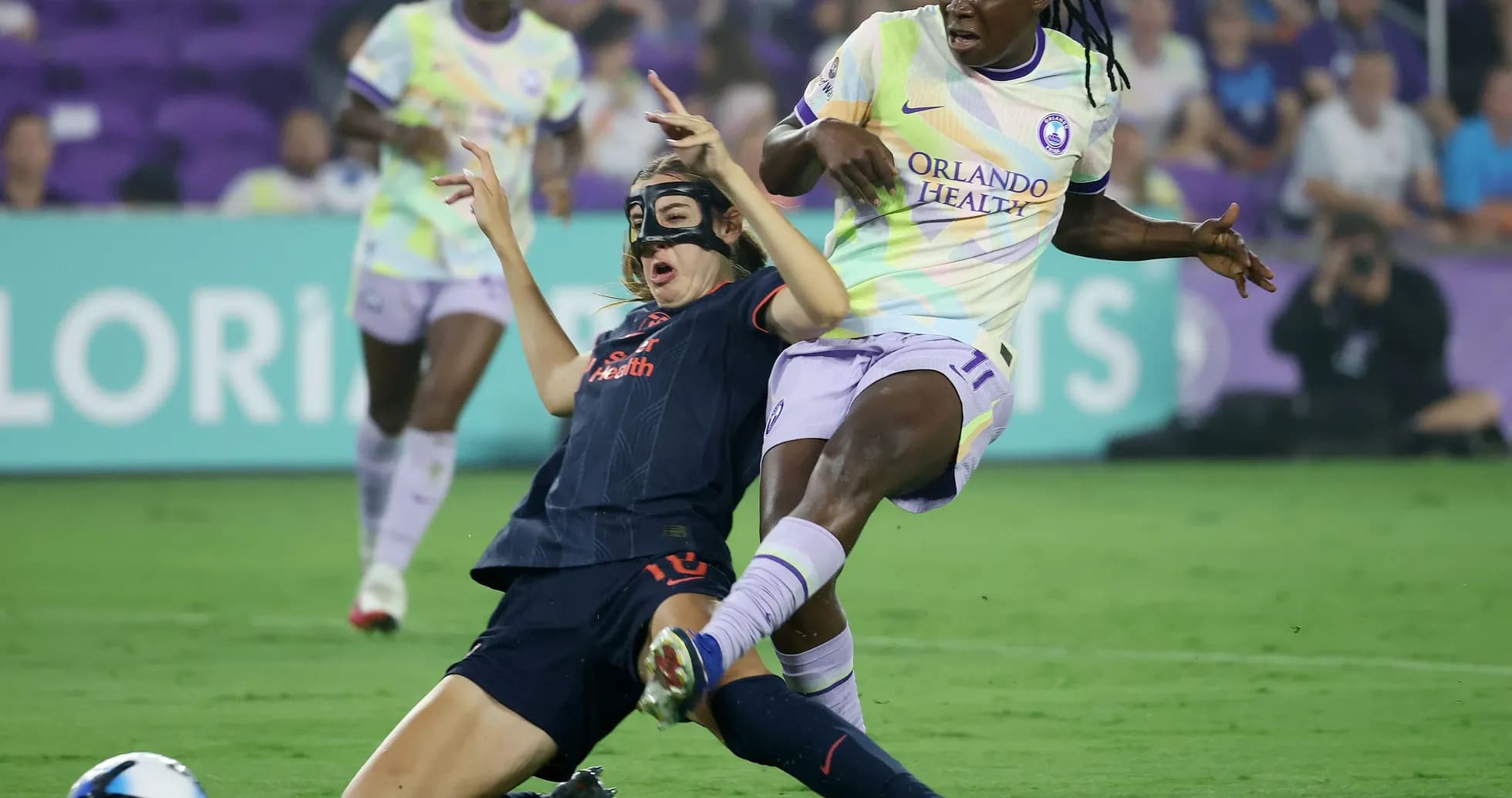 Players colliding during NWSL match