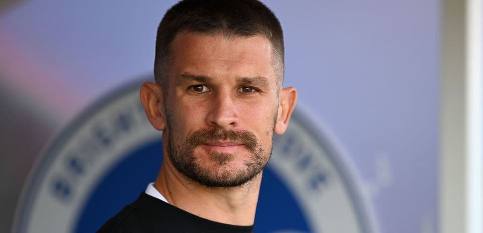 Close-up of a male player with a beard