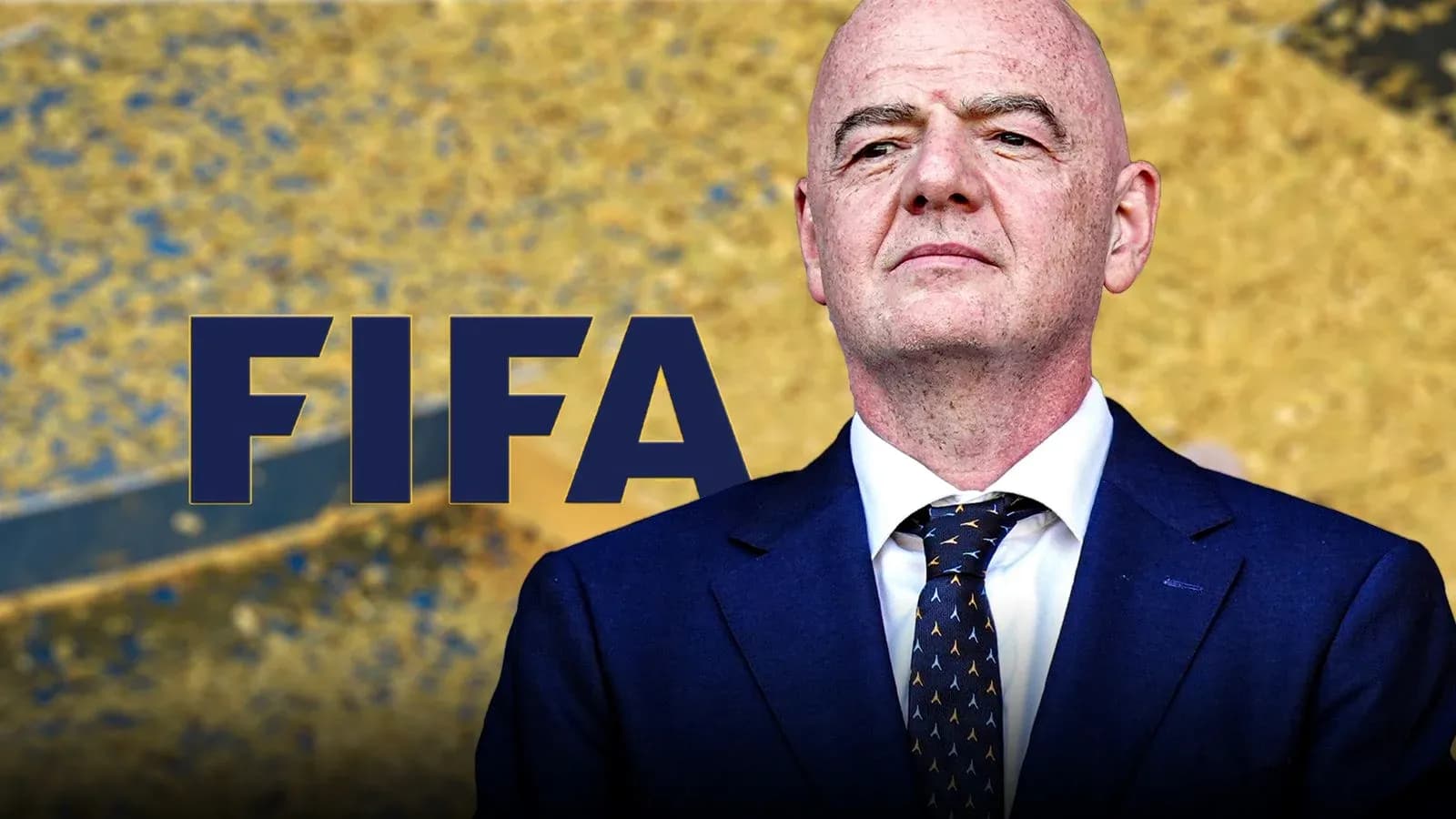 FIFA president standing in front of FIFA logo