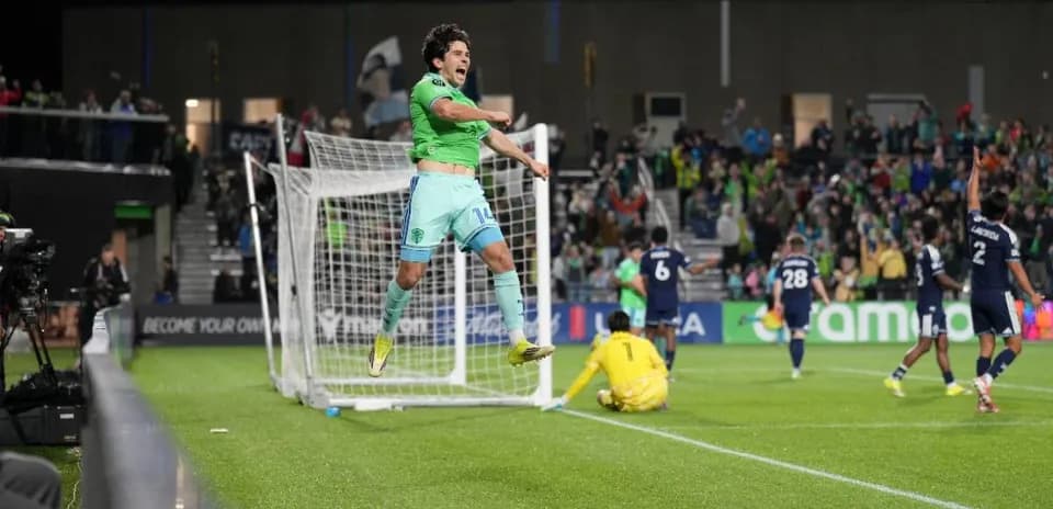 Player celebrating goal during Seattle Sounders match