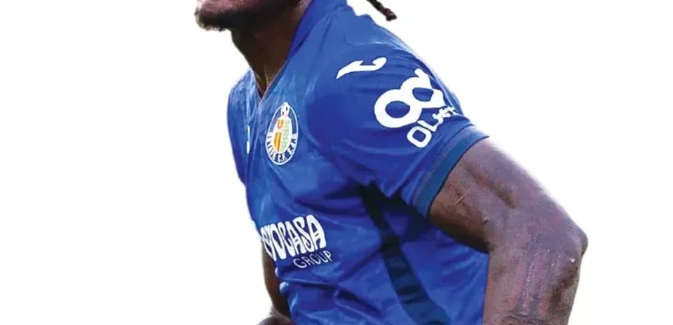 Player in blue jersey celebrating during match