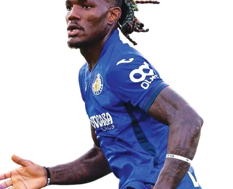 Player in blue jersey celebrating during match