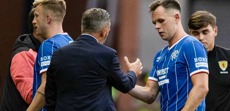 Manager greeting players during match substitution