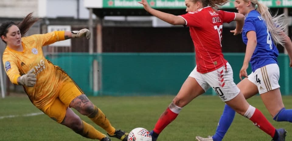Goalkeeper attempting to save during match