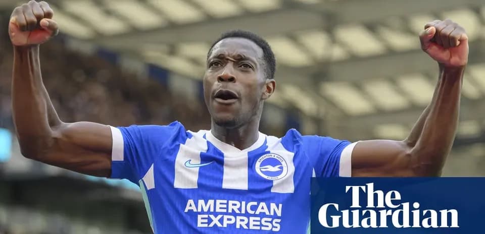 Football player celebrating in Brighton kit