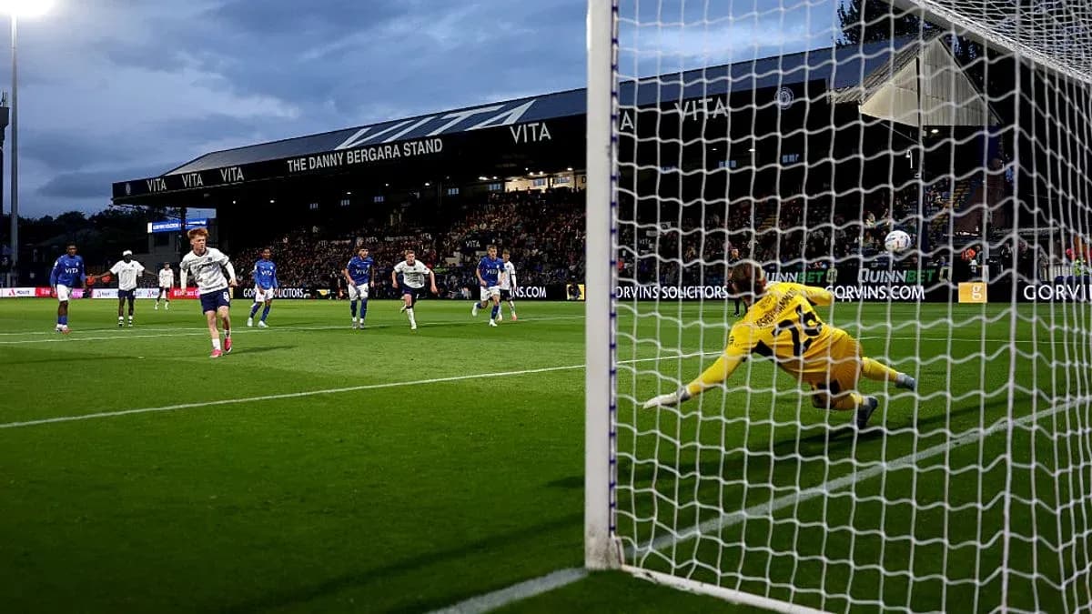 Player taking a penalty kick against the goalkeeper
