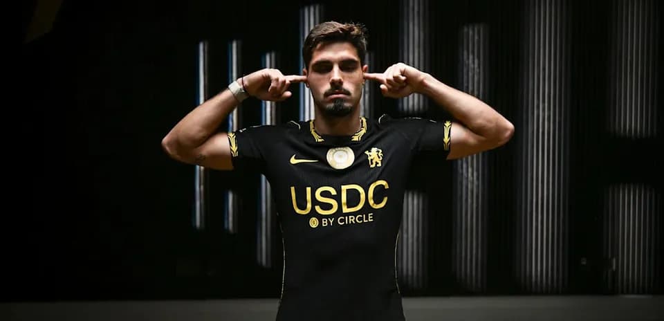 Player in black jersey blocking ears with hands