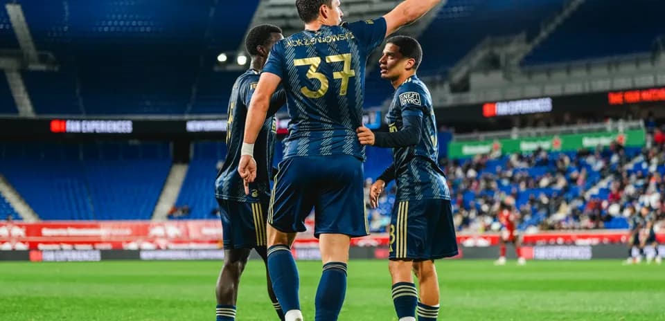 Players celebrating a goal during match
