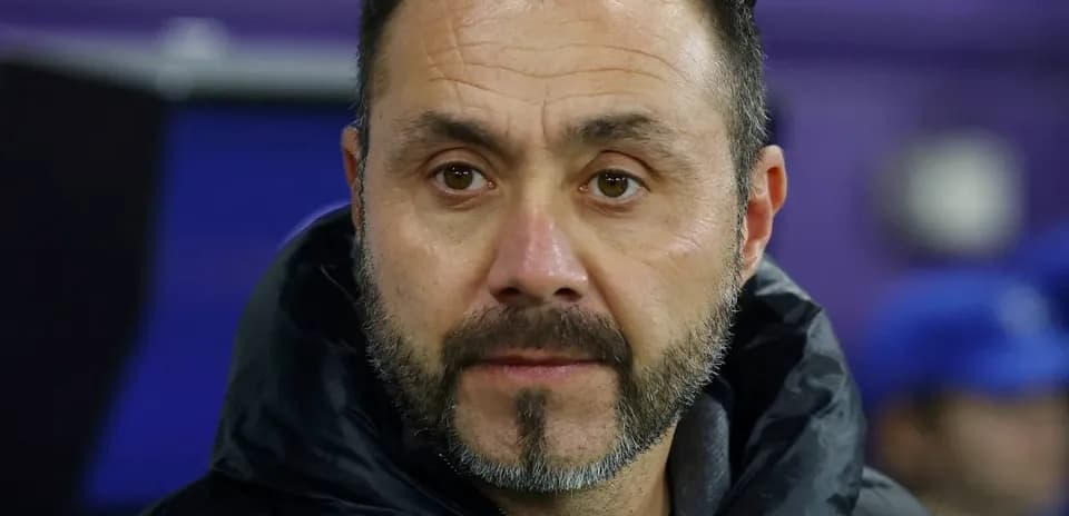 Coach observing the match from the sidelines