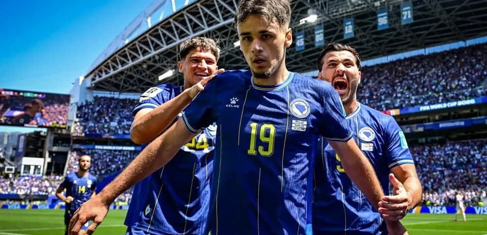 Bosnia players celebrating goal during World Cup match