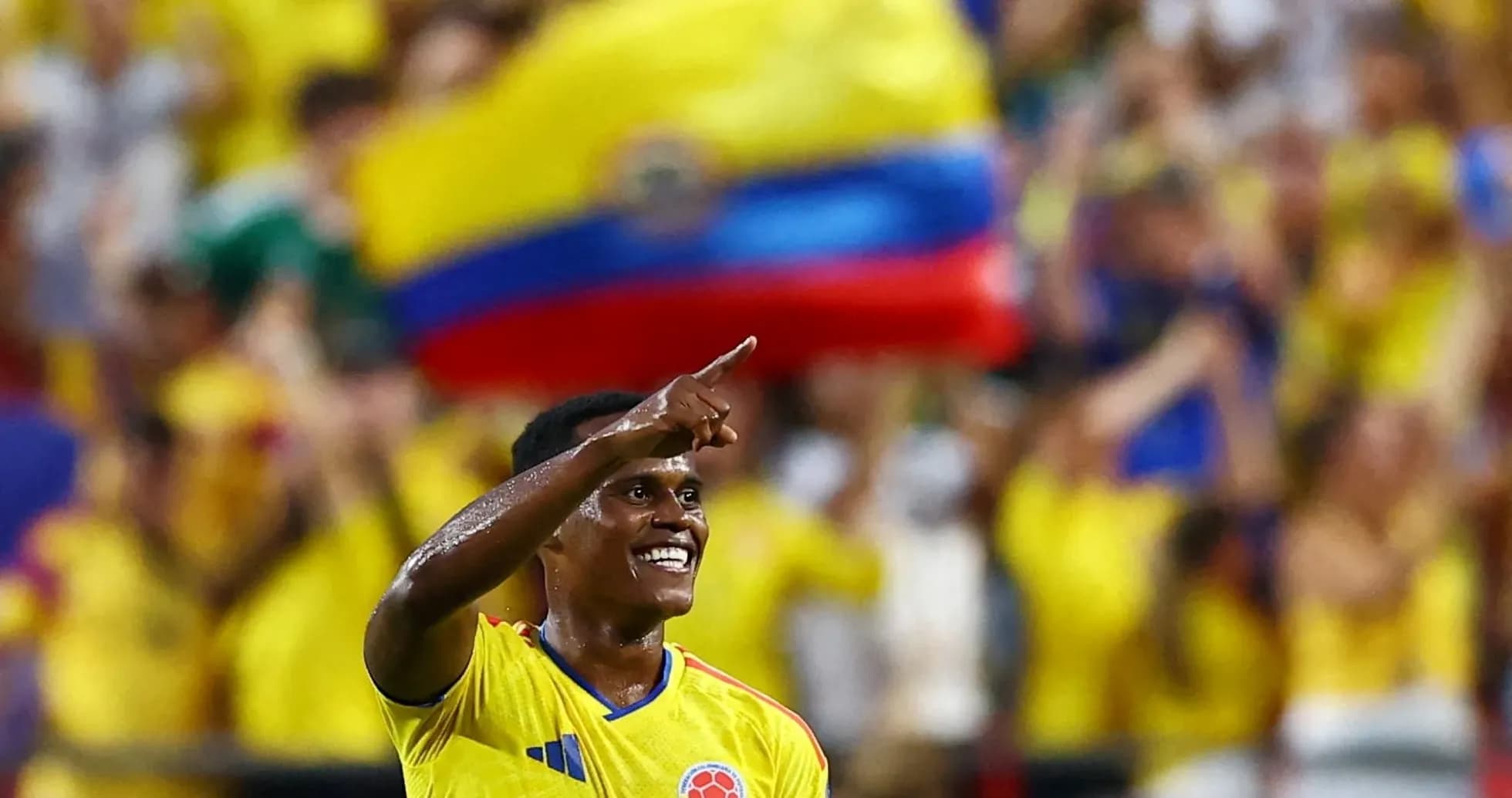 Player celebrating with fans in yellow jerseys