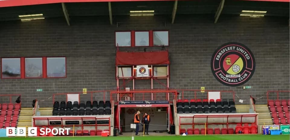 Ebbsfleet United's stadium with staff near entrance