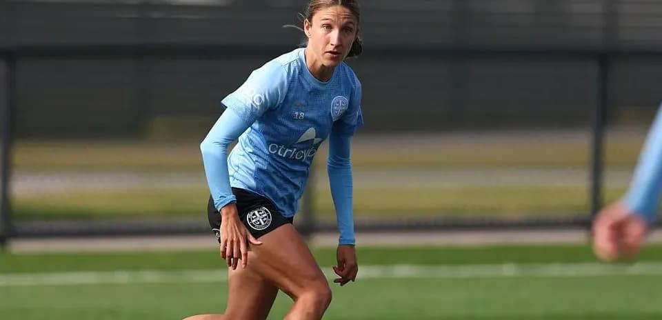 Player running during training session on pitch