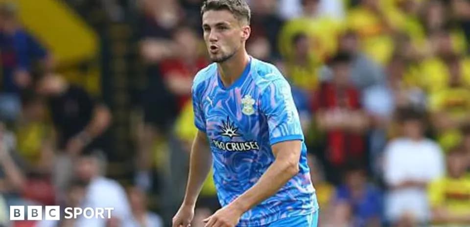 Player in blue jersey during match at stadium