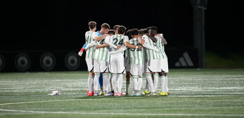 Austin II players huddling before the match