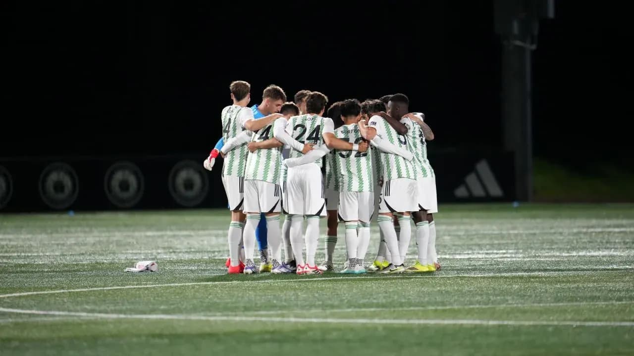 Austin II players huddling before the match