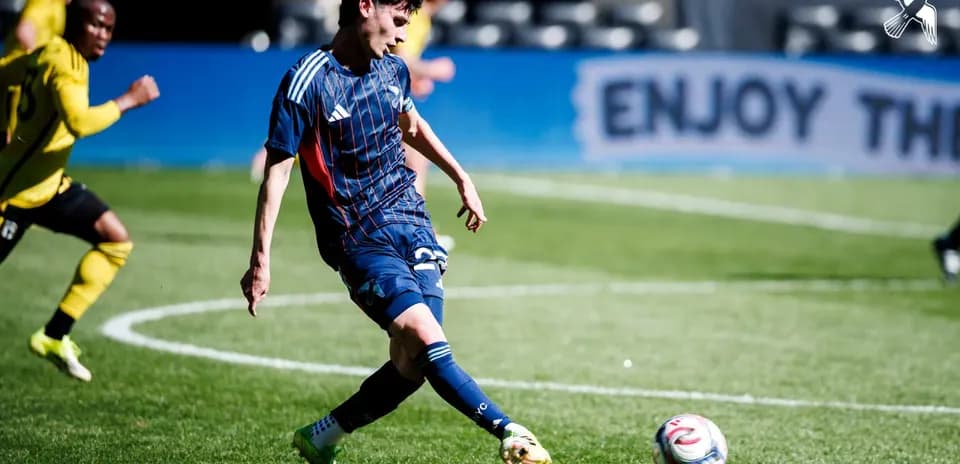 Player kicking the ball during match