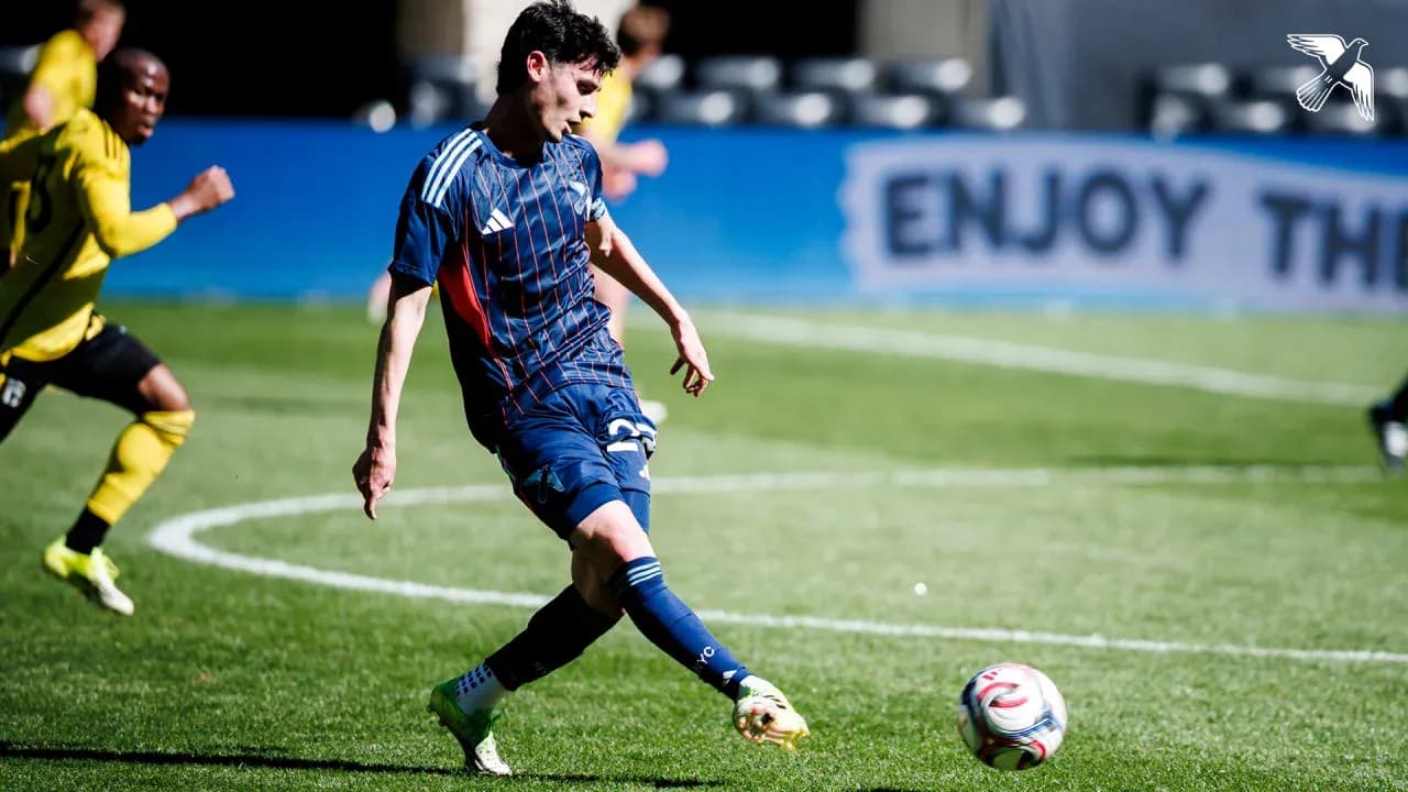 Player kicking the ball during match