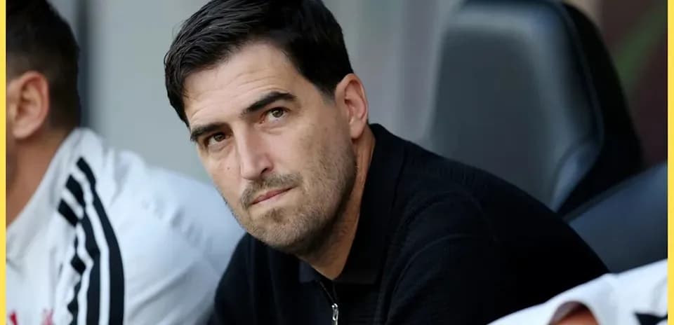Coach observing from the bench during a match