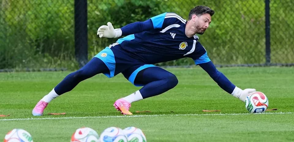 Goalkeeper diving to save a ball during training
