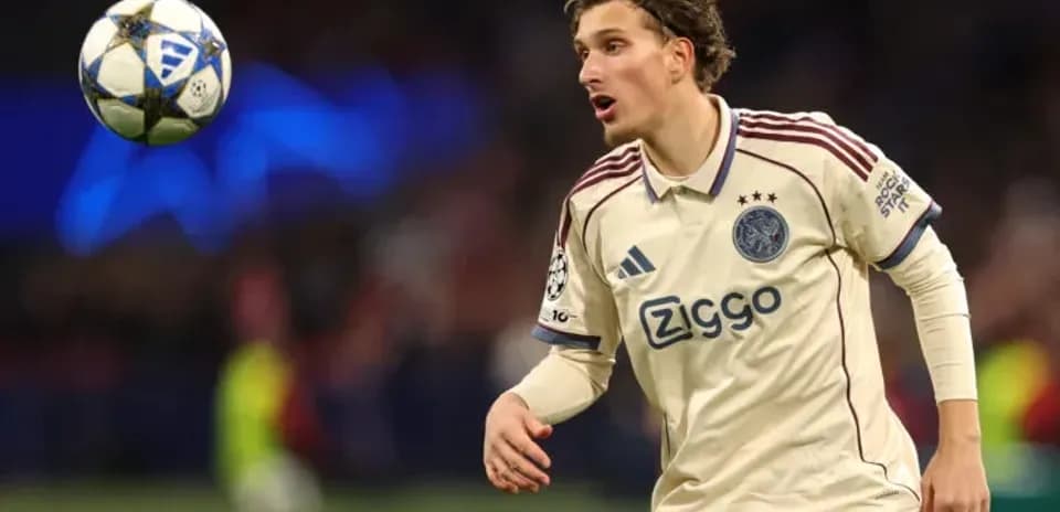 Player from Ajax chasing a ball during match