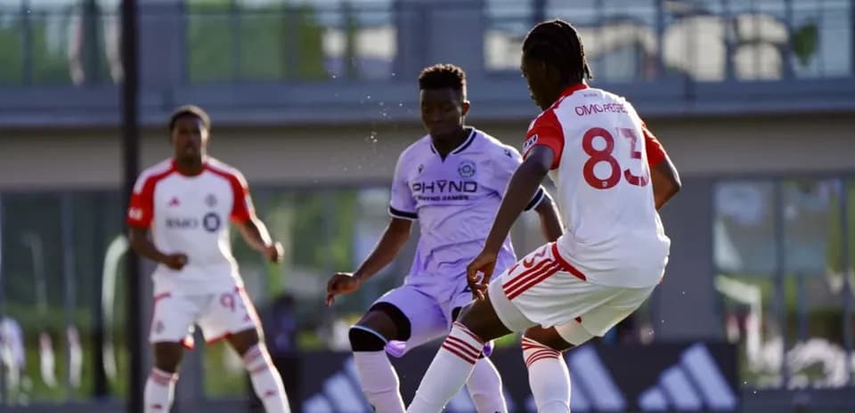 Players competing for the ball during match