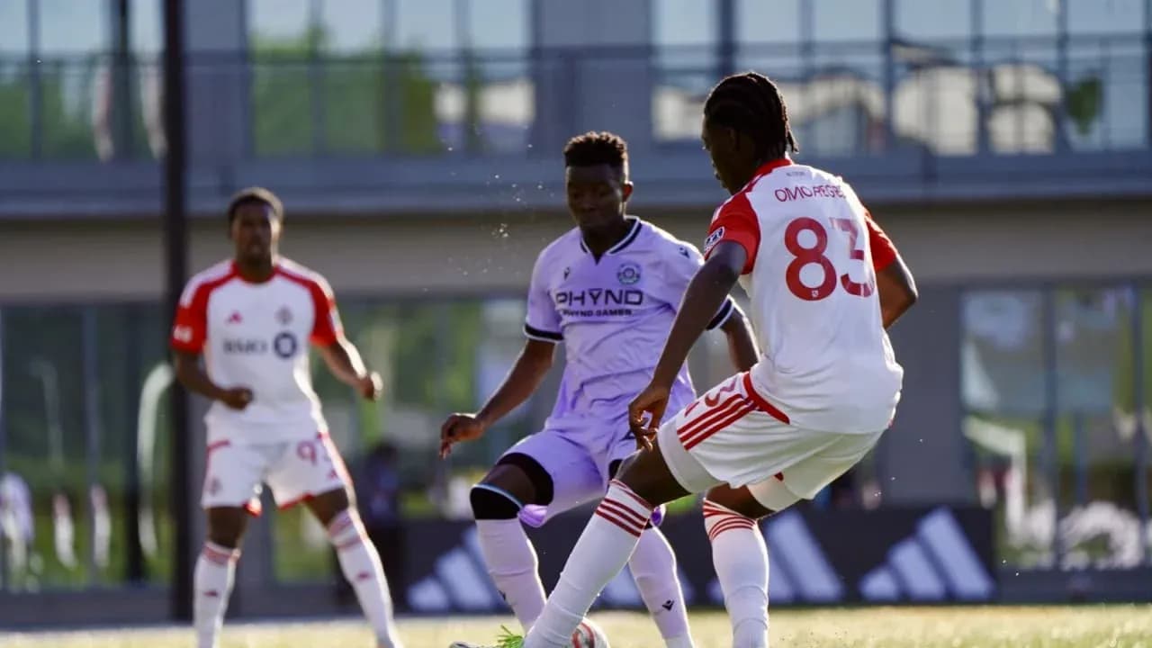 Players competing for the ball during match