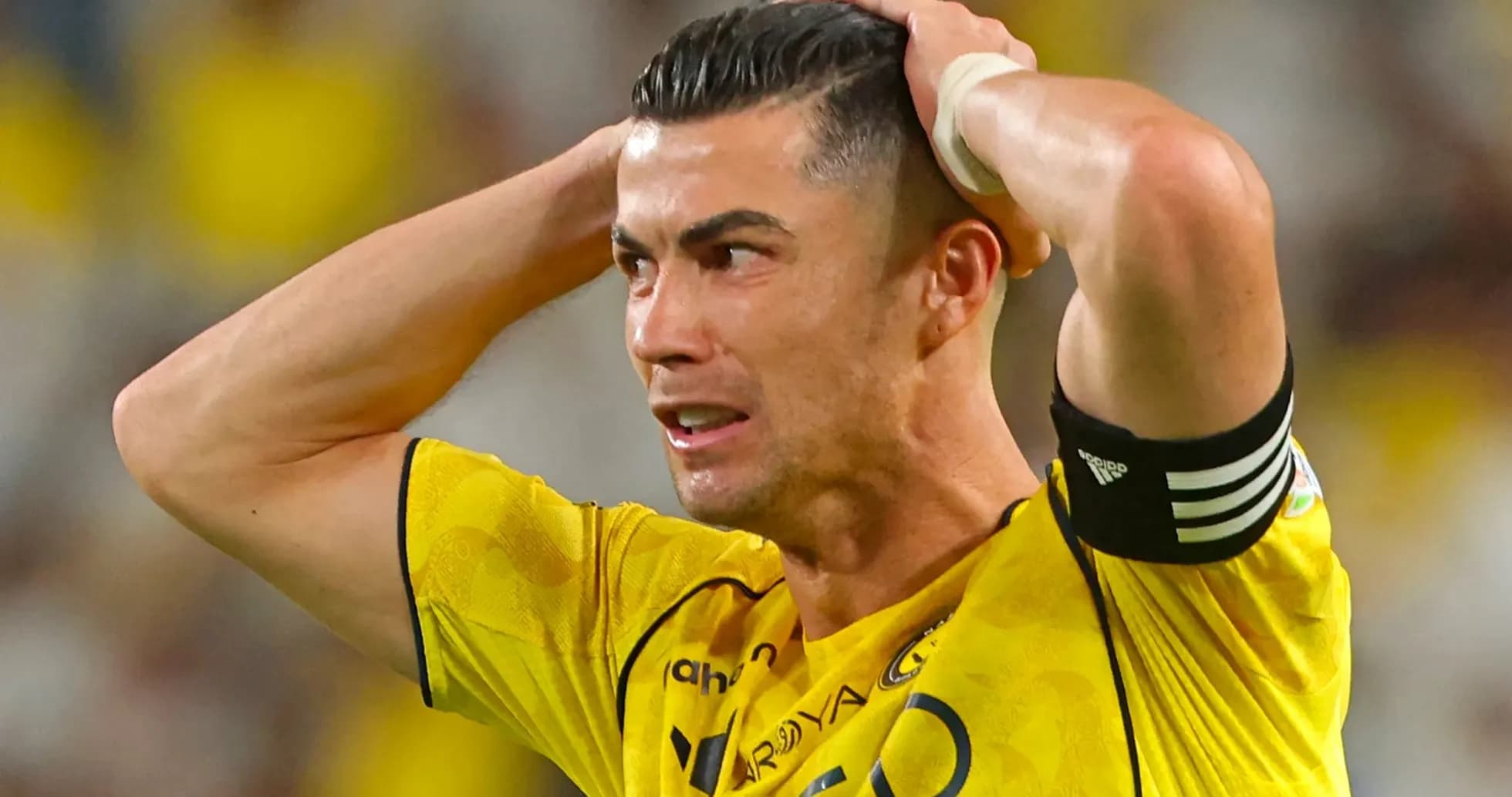 Player holding head in distress during match
