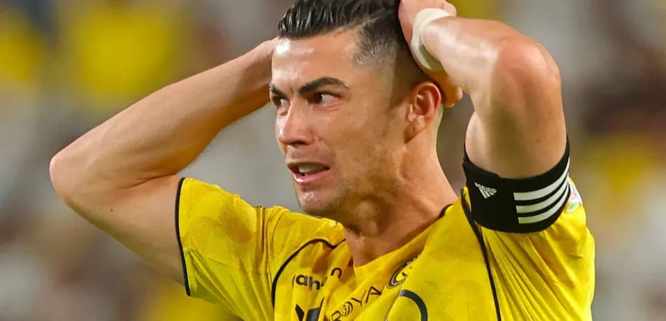 Player holding head in distress during match