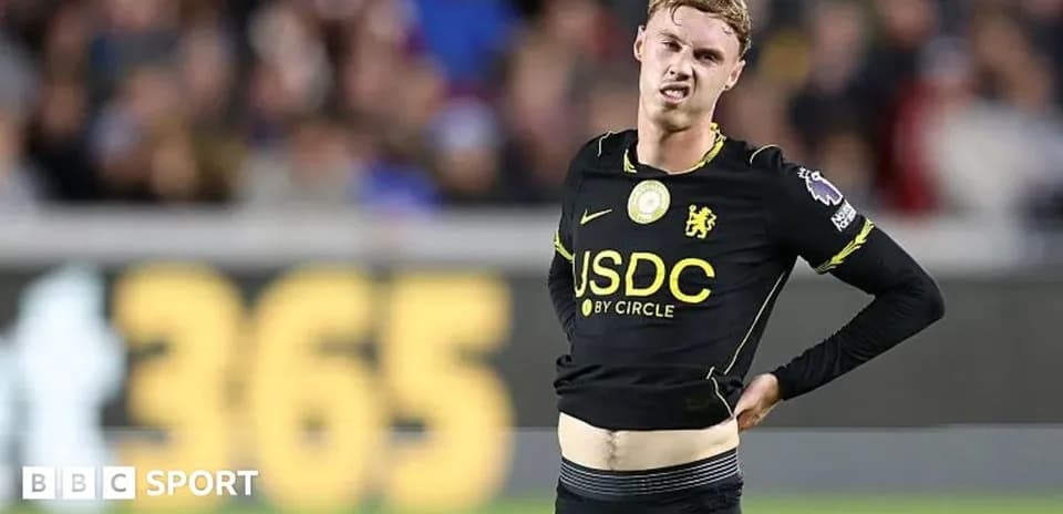 Player adjusting shirt during match at stadium
