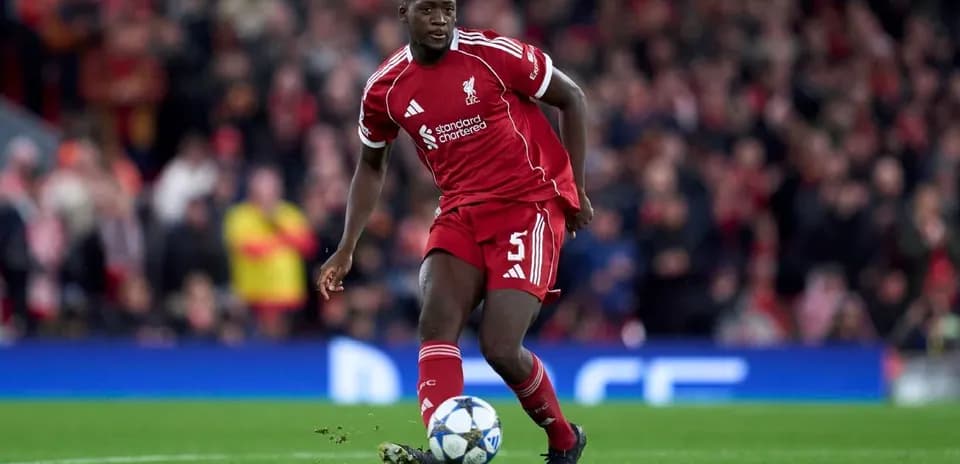 Liverpool player dribbling the ball on pitch
