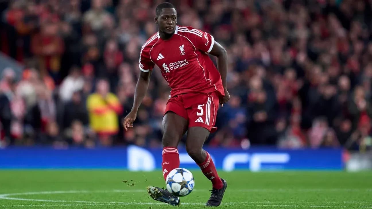 Liverpool player dribbling the ball on pitch