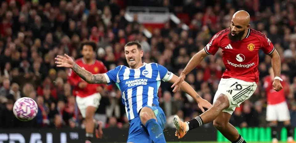 Brighton player tackles Manchester United player