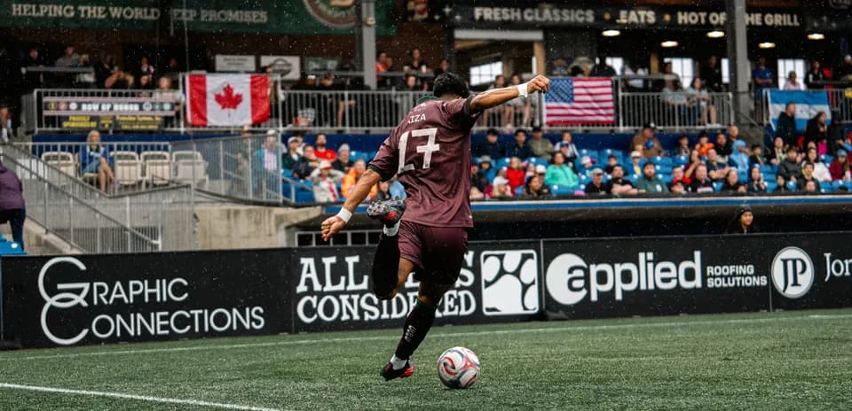 Player taking a corner kick during match