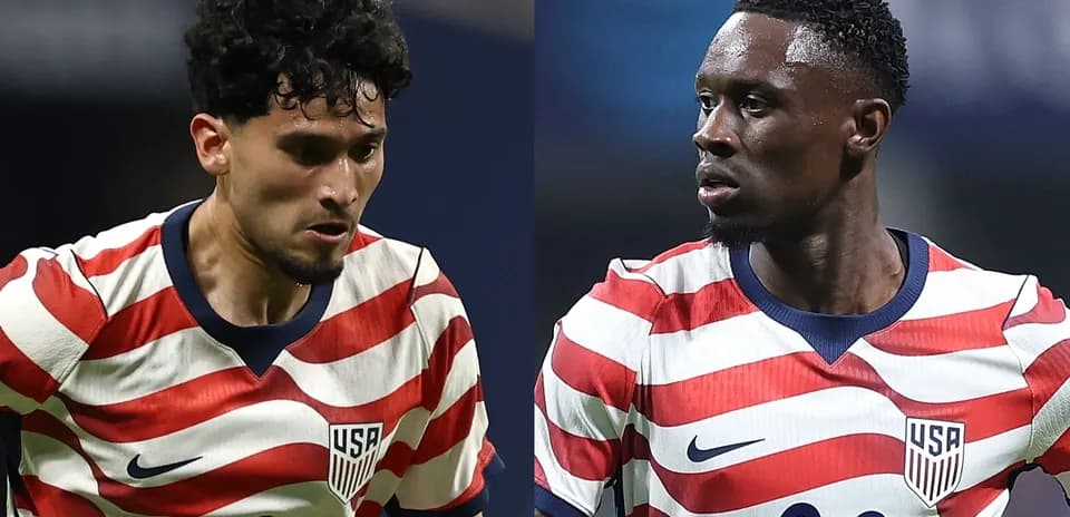Two USA soccer players in striped jerseys during match