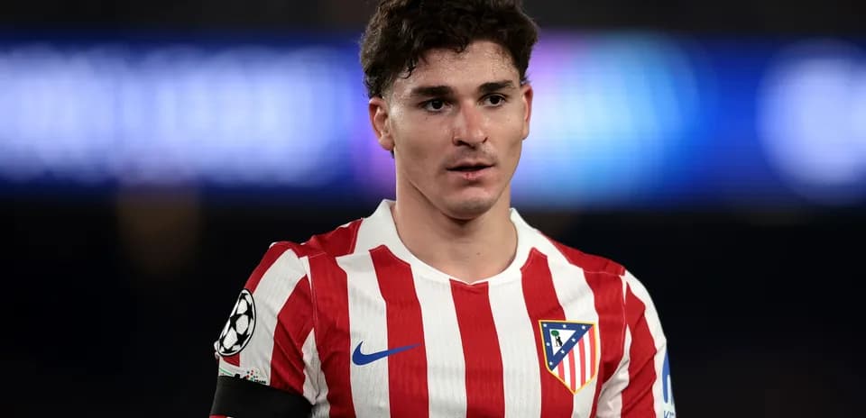 Atletico Madrid player in red and white jersey