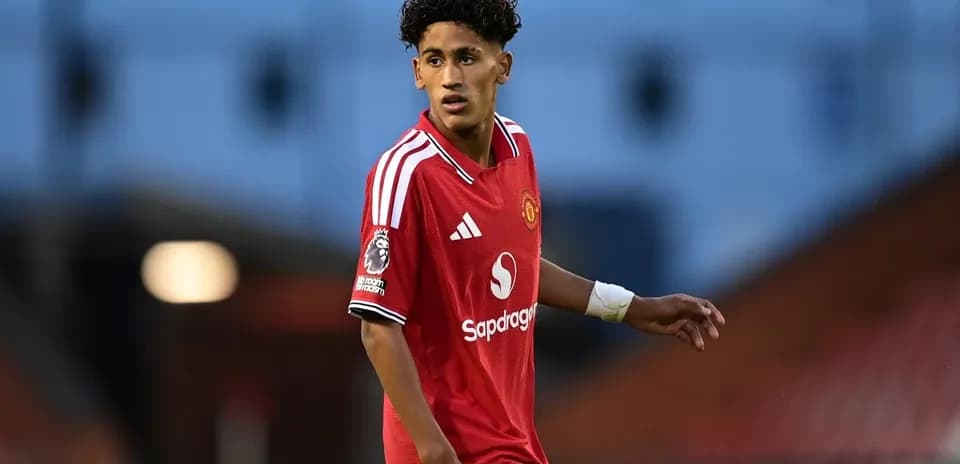 Player in red Manchester United kit on pitch