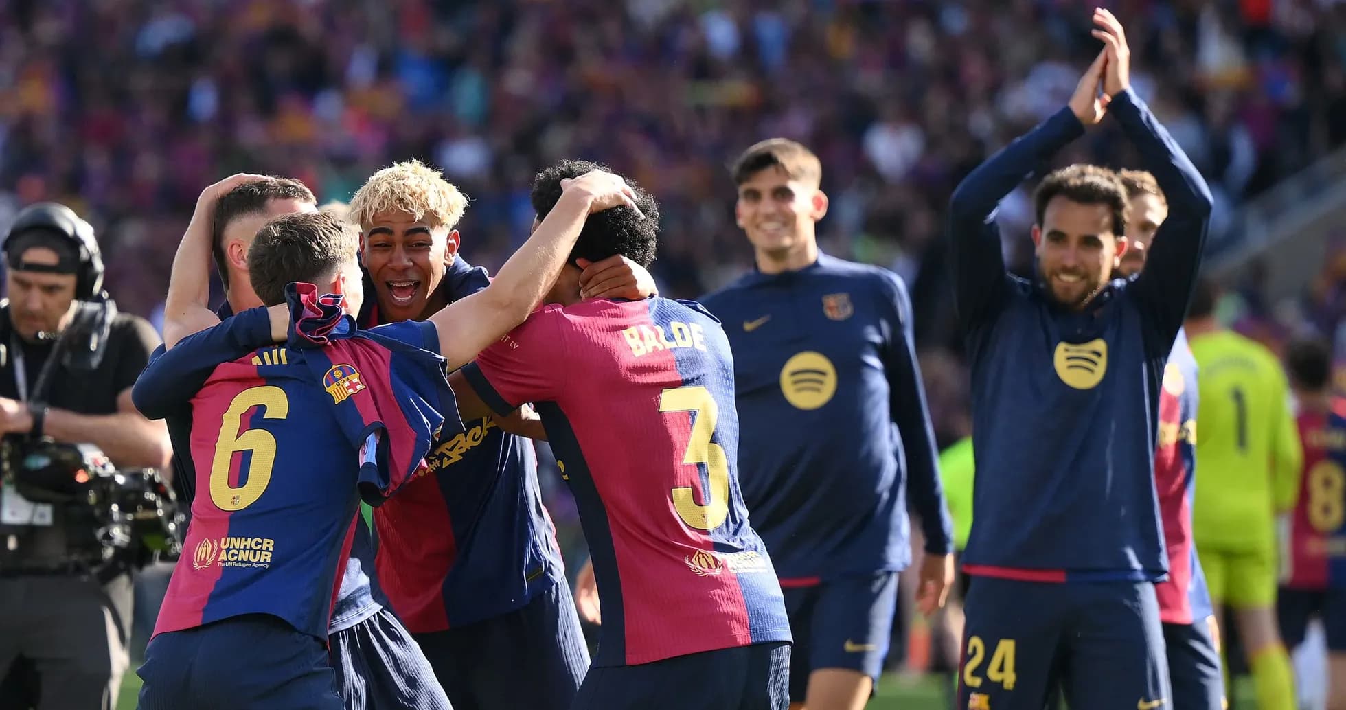 Barcelona players celebrating together on the pitch