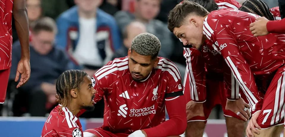 Liverpool players discussing on the pitch during match