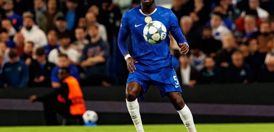 Player in blue jersey controlling the ball on field
