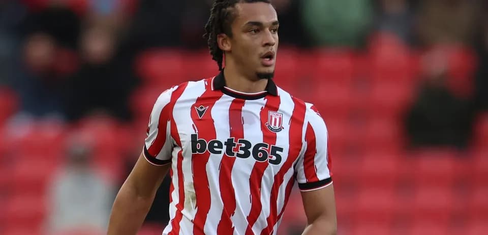 Player in red and white striped jersey during match